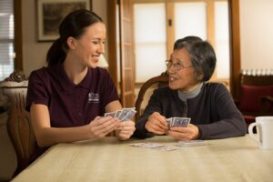b 363 1587680254Caregiver and Senior Playing Cards